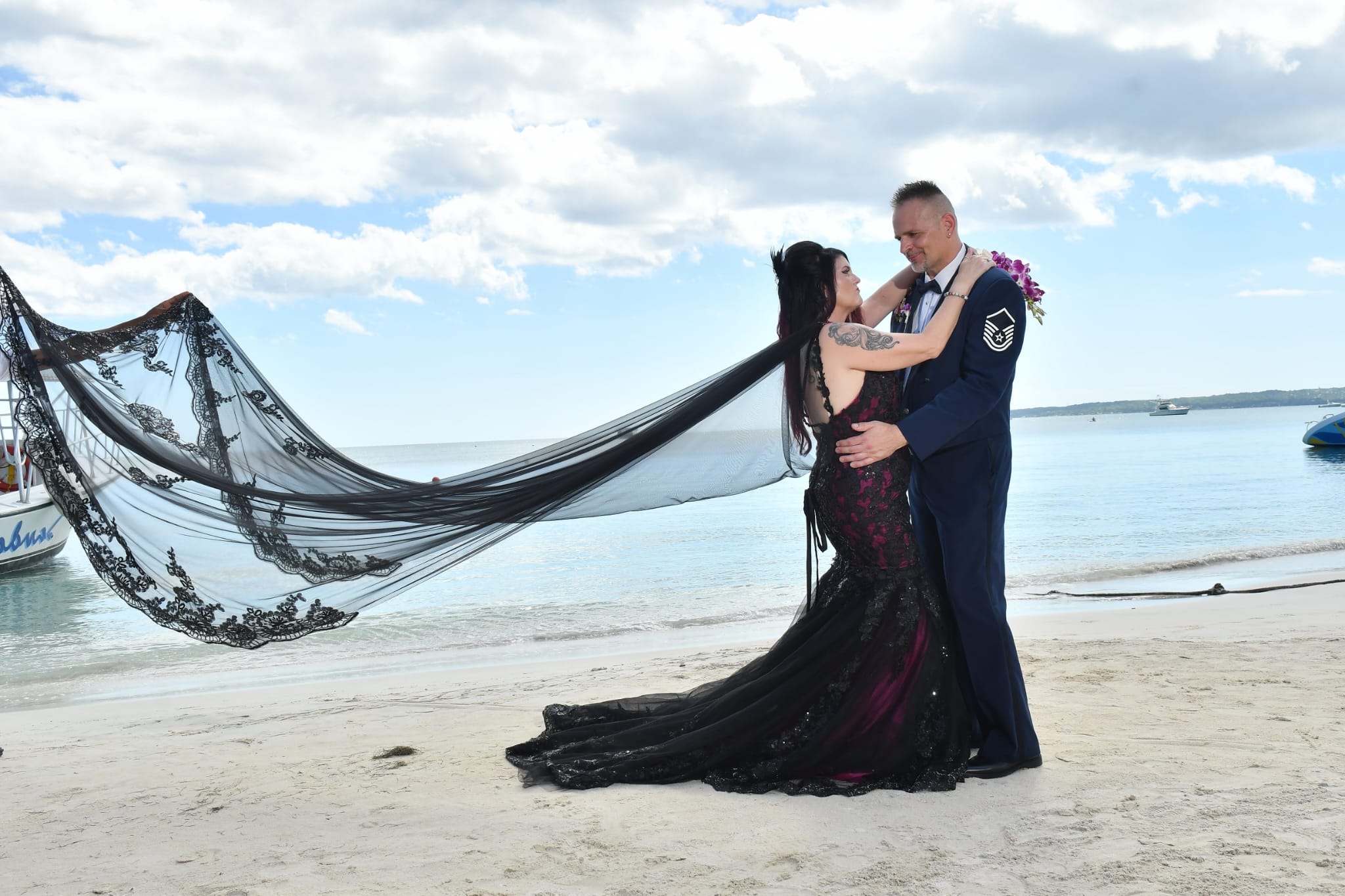 Rolla Hinkley on the beach in a wedding gown